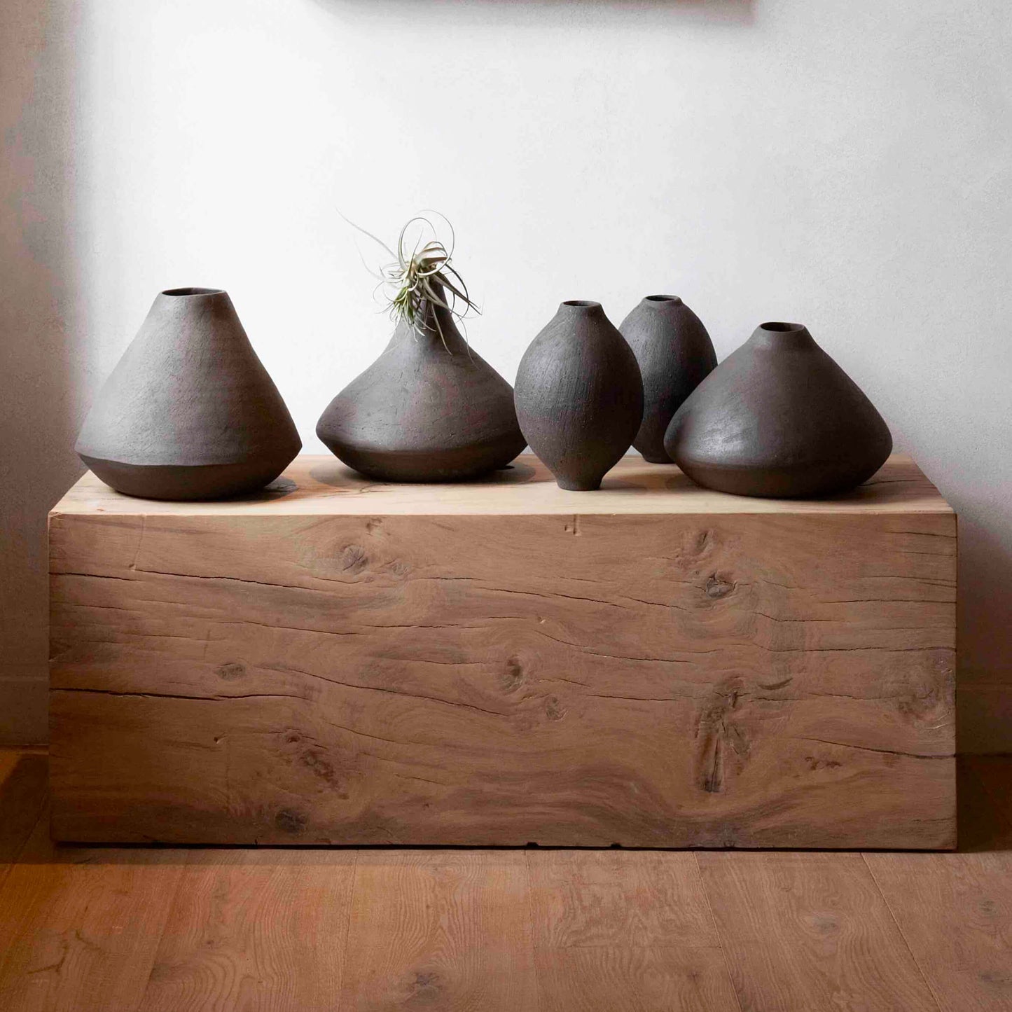 Group of black ceramic decor vessels