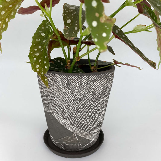 Black ceramic planter with white texture